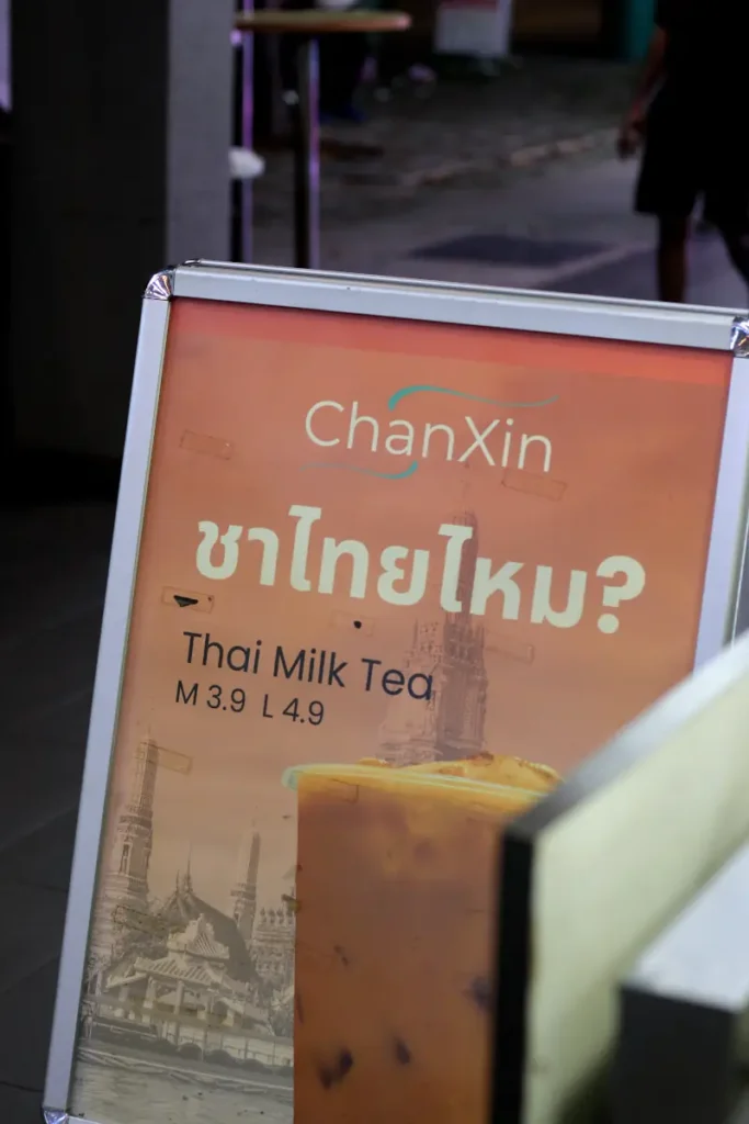 An image showing a signage selling Thai Milk Tea