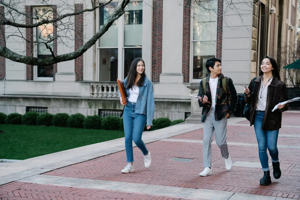 An image of university students walking on campus grounds